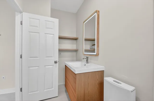 a view of a brick house with a large windows