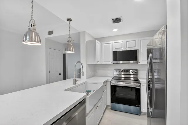 a kitchen with a stove and a microwave