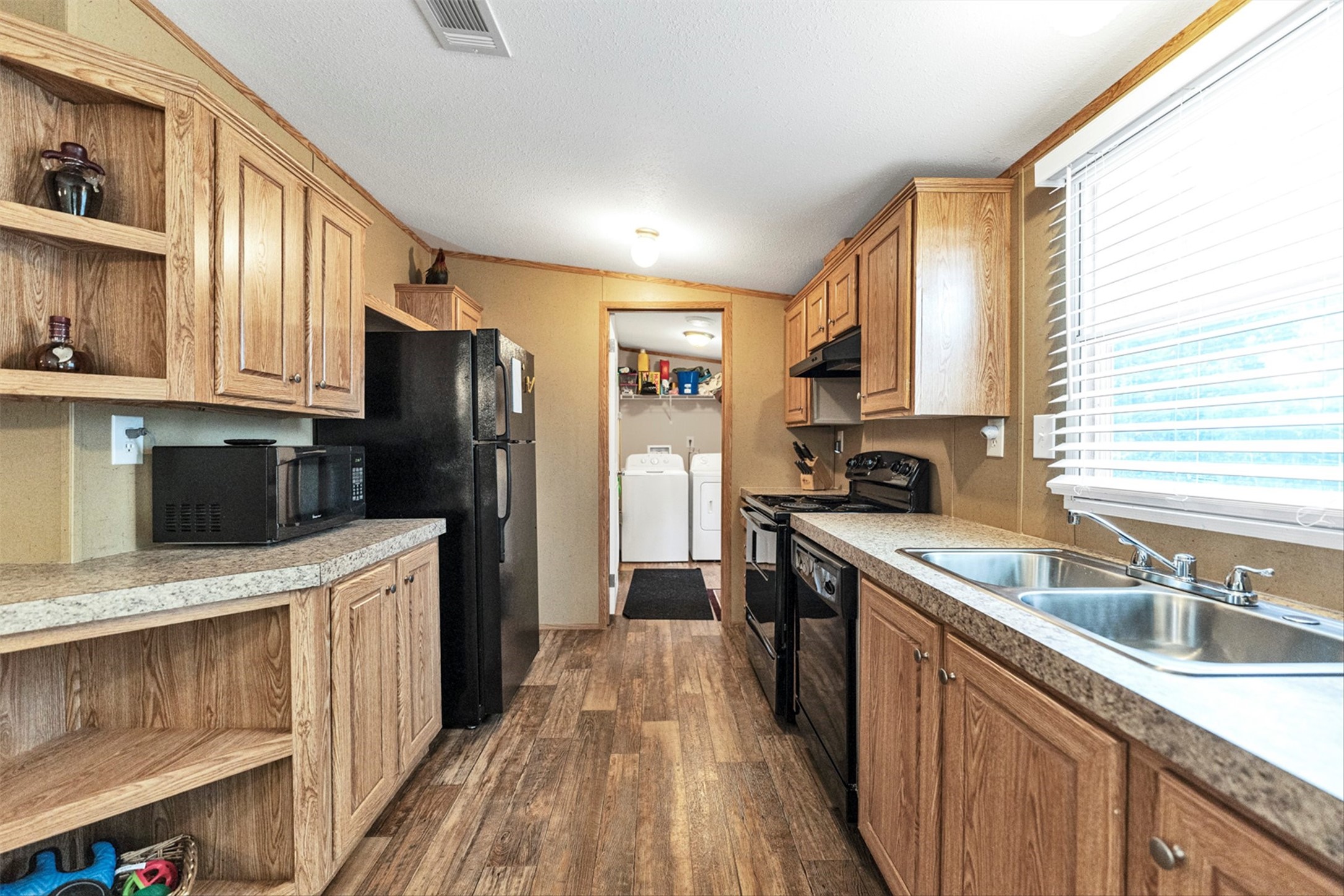 50 Fm 3179 Road Huntsville, TX 77320 - Photo 15 of 45 Kitchen offers abundant storage and generous counter space designed to make cooking and gathering easy.