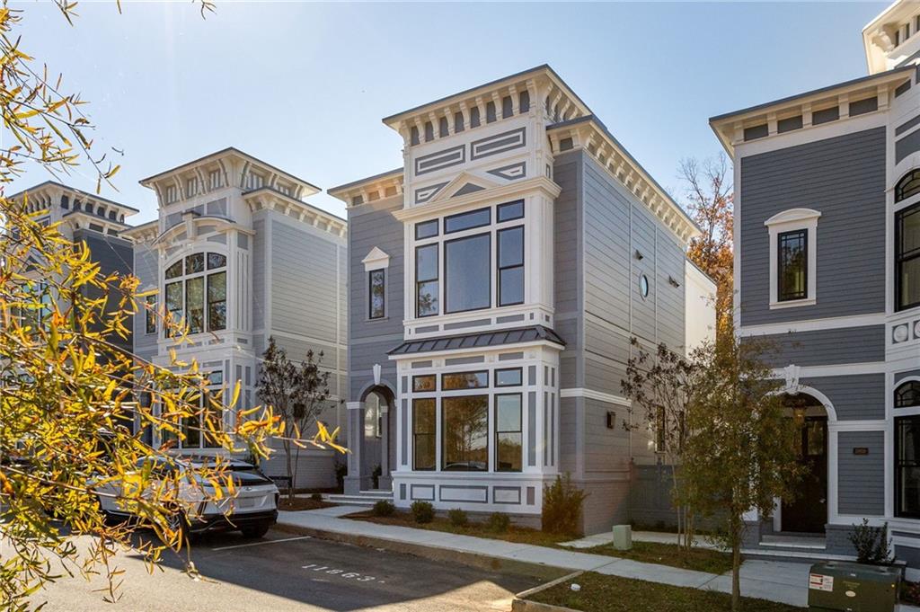 a front view of a building with a garden