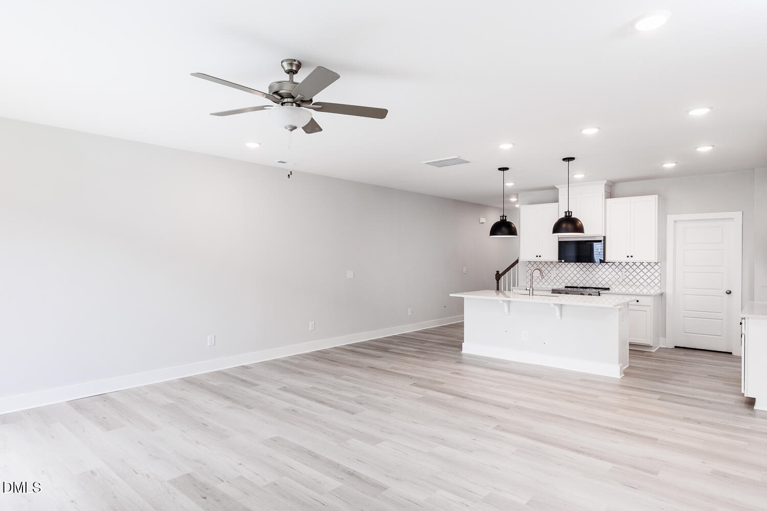 35 Silver Pne Drive Angier, NC 27501 - Photo 12 of 41 a living room with kitchen island furniture and a ceiling fan