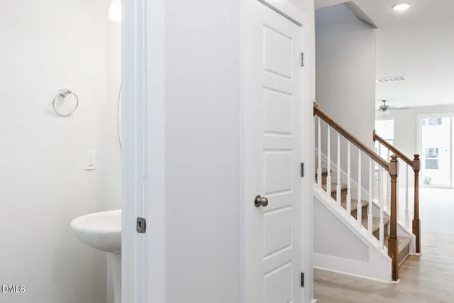 a view of a hallway with staircase