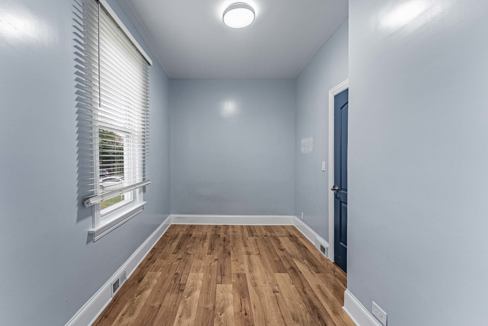 1330 Ridgeland Avenue Berwyn, IL 60402 - Photo 12 of 23 a view of a room with wooden floor and windows