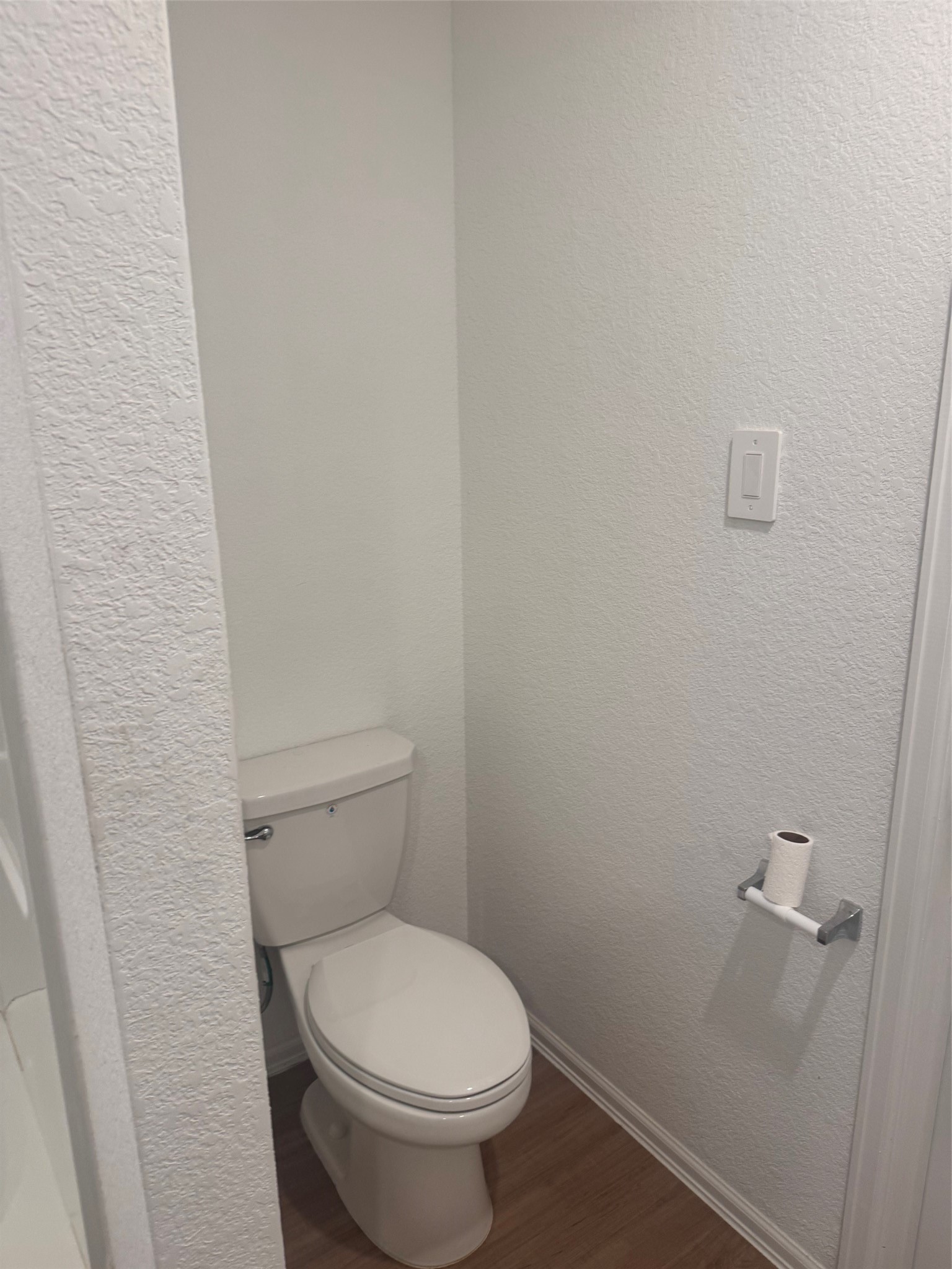 3202 Holly Stokes Way Conroe, TX 77301 - Photo 18 of 24 a white toilet sitting next to a white wall