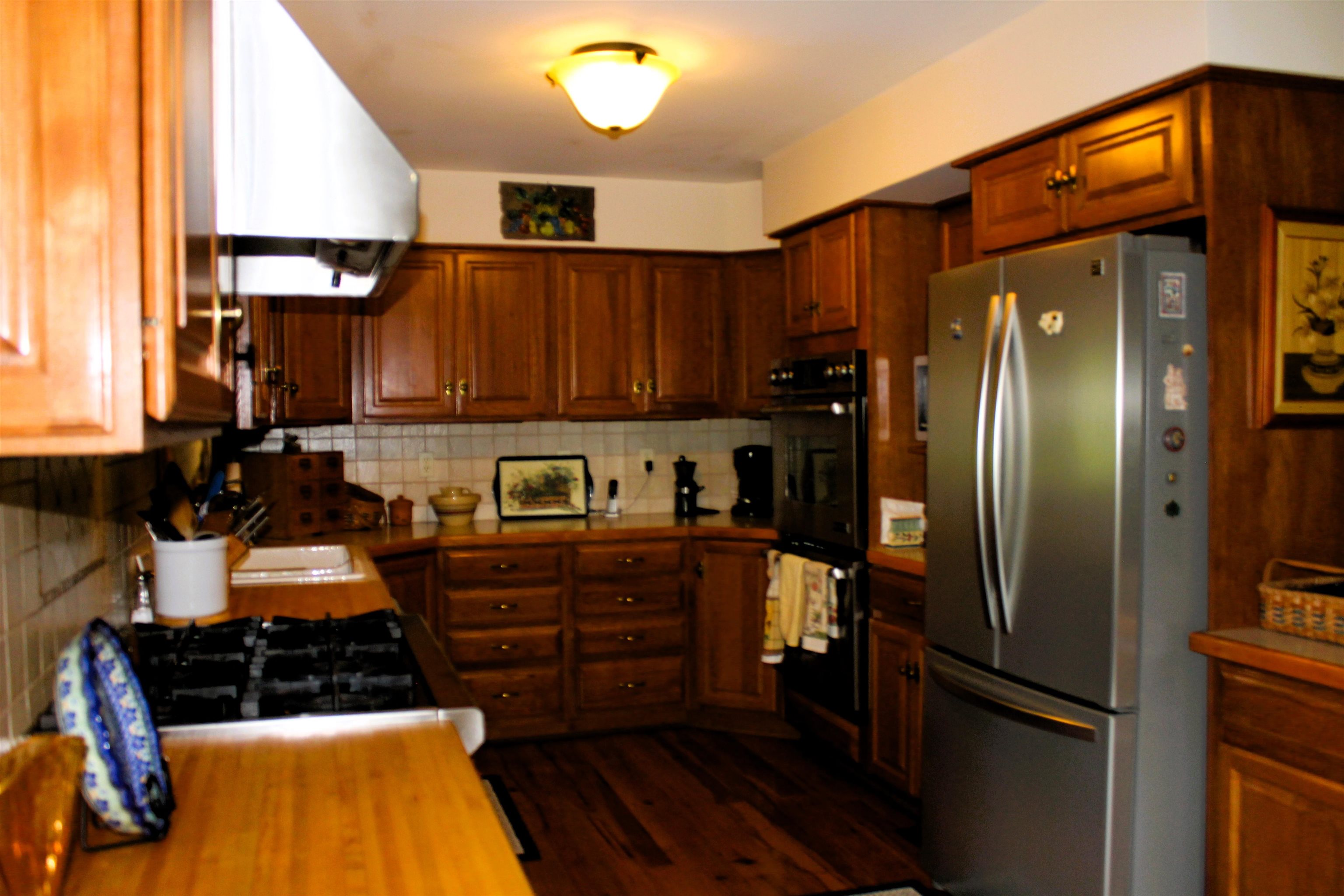 625 Hummingbird Lane Monterey, VA 24465 - Photo 13 of 65 a kitchen with stainless steel appliances granite countertop a refrigerator and a stove
