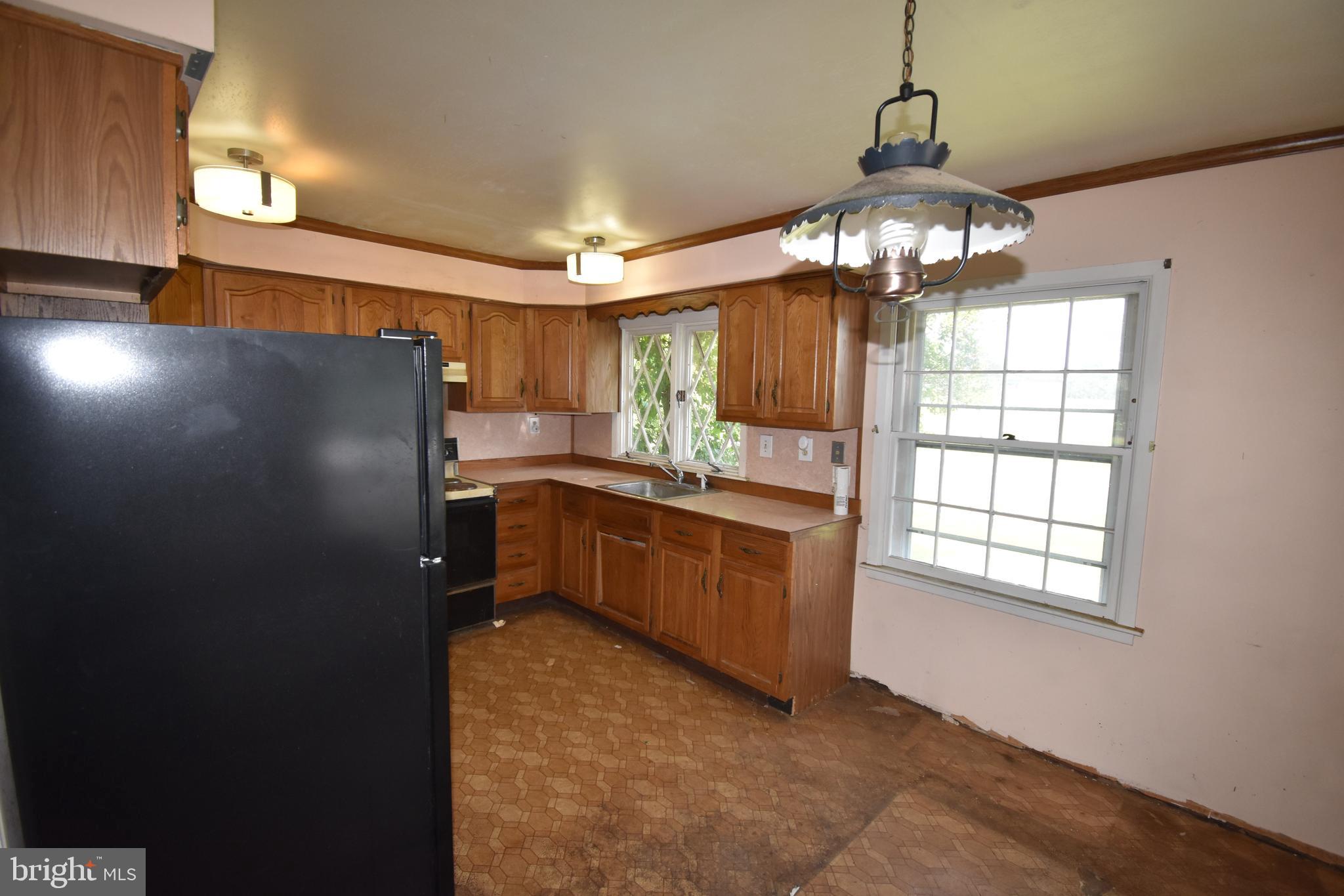 15 Sunset Road Willingboro, NJ 08046 - Photo 8 of 19 a kitchen with granite countertop stainless steel appliances a window and refrigerator
