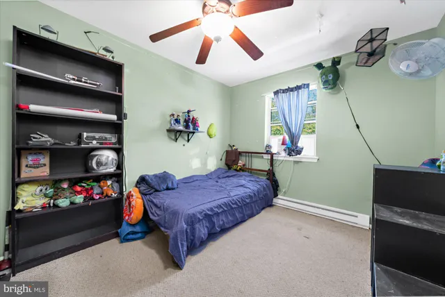 a bedroom with bed and a window