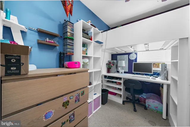 a room with furniture and a flat screen tv