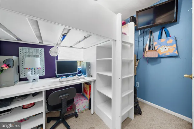 a view of a workspace with furniture