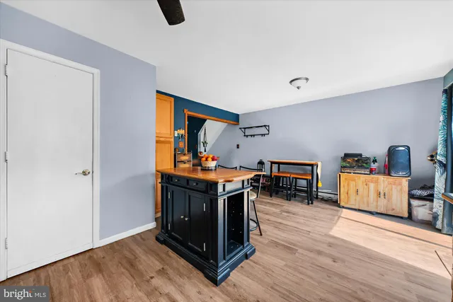 a view of work space with furniture and wooden floor