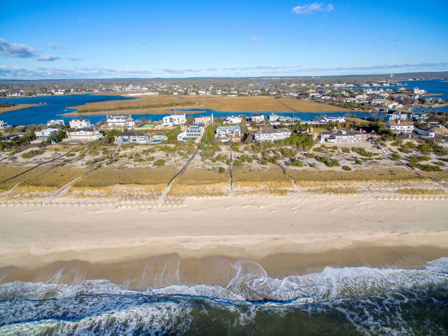 127 Dune Road Westhampton Beach, NY 11978 - Photo 1 of 1 Bird's eye view with a water view and a view of the beach