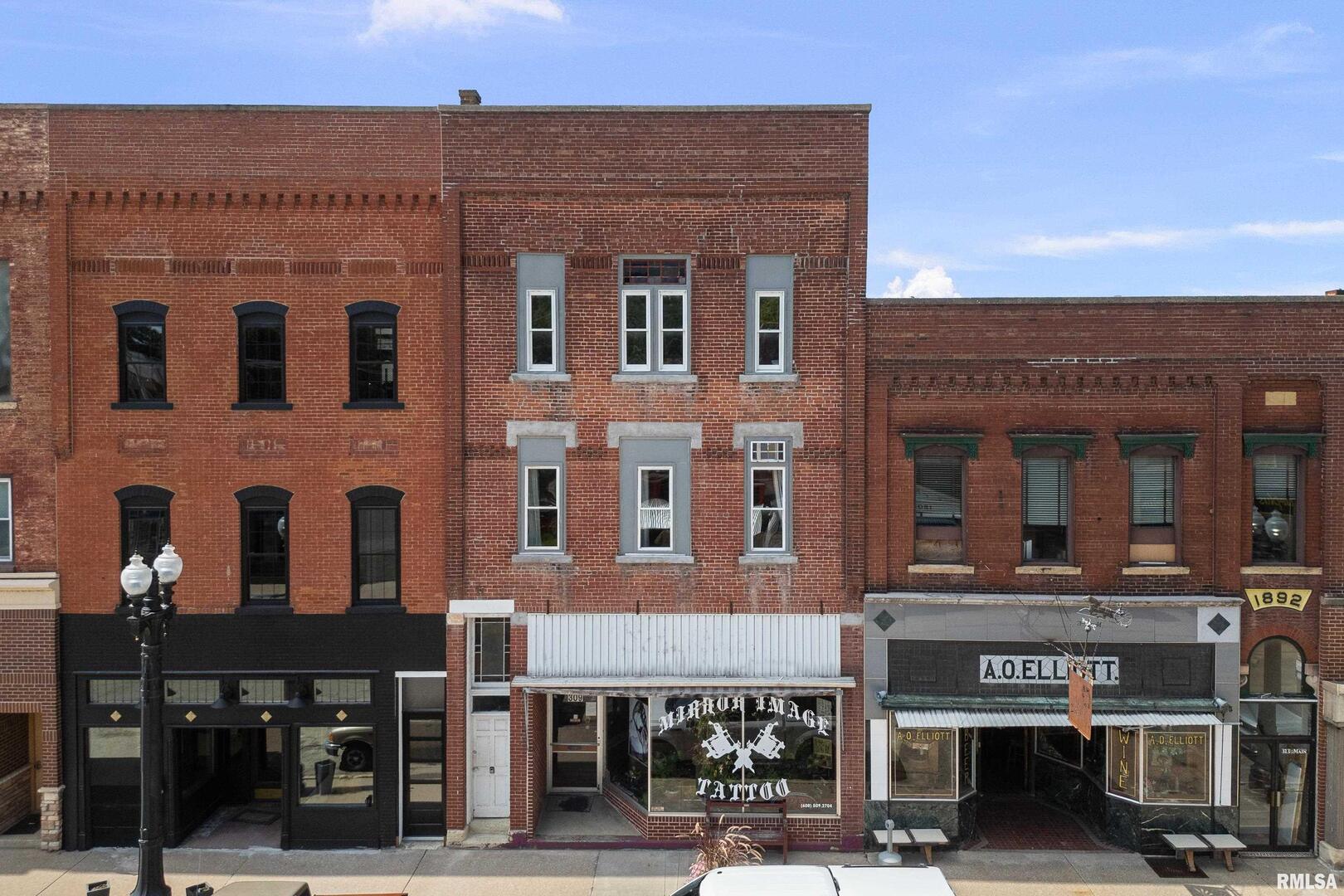 a front view of a building with street view