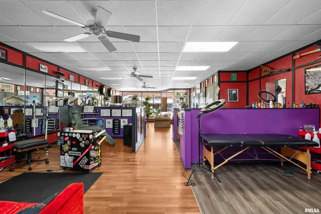 a utility room with dryer washer and a flat screen tv