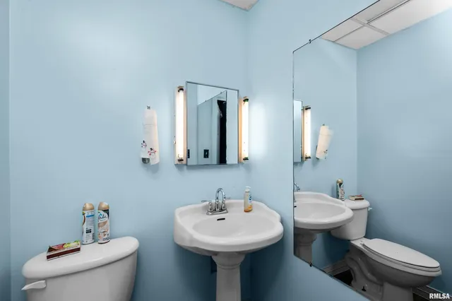 a living room with furniture a flat screen tv and a large window