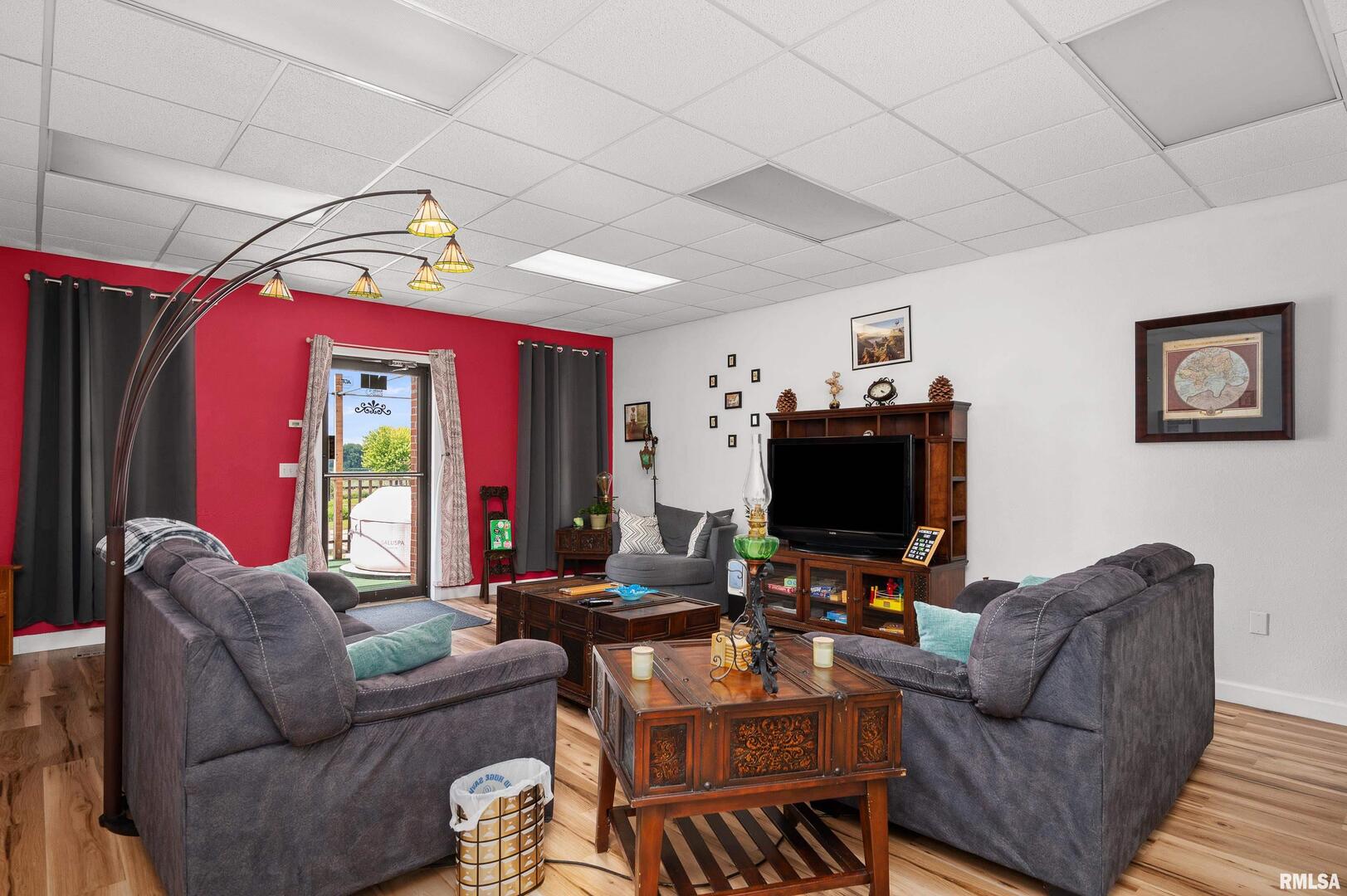 309 Main Street Savanna, IL 61074 - Photo 19 of 58 a living room with furniture and a flat screen tv