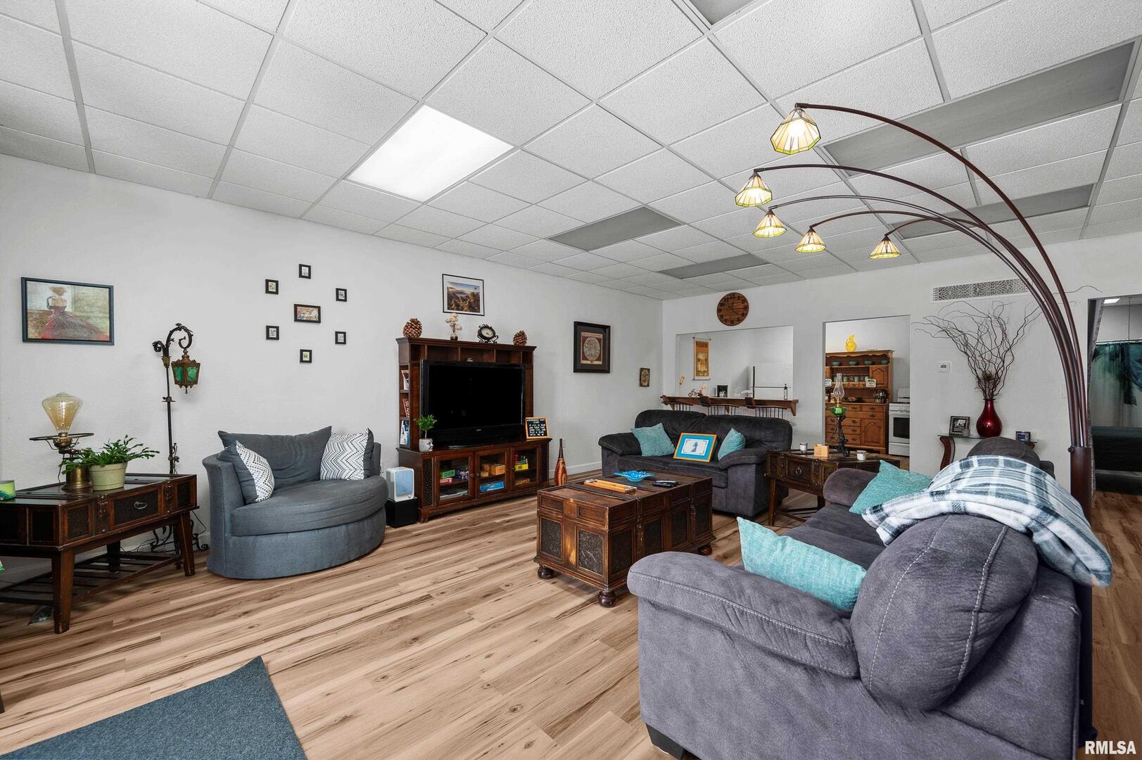 309 Main Street Savanna, IL 61074 - Photo 20 of 58 a living room with furniture a flat screen tv and a large window