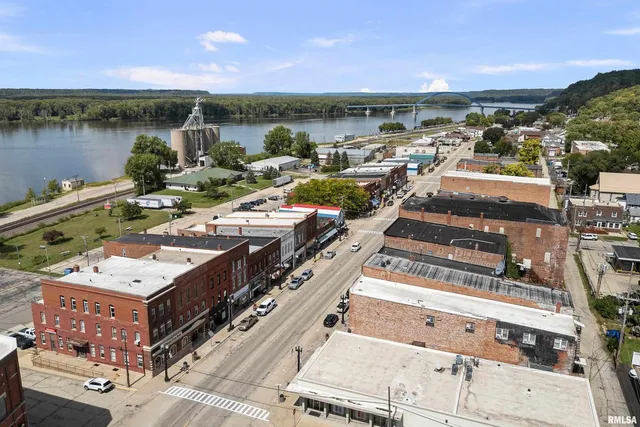 a view of city from balcony with furniture