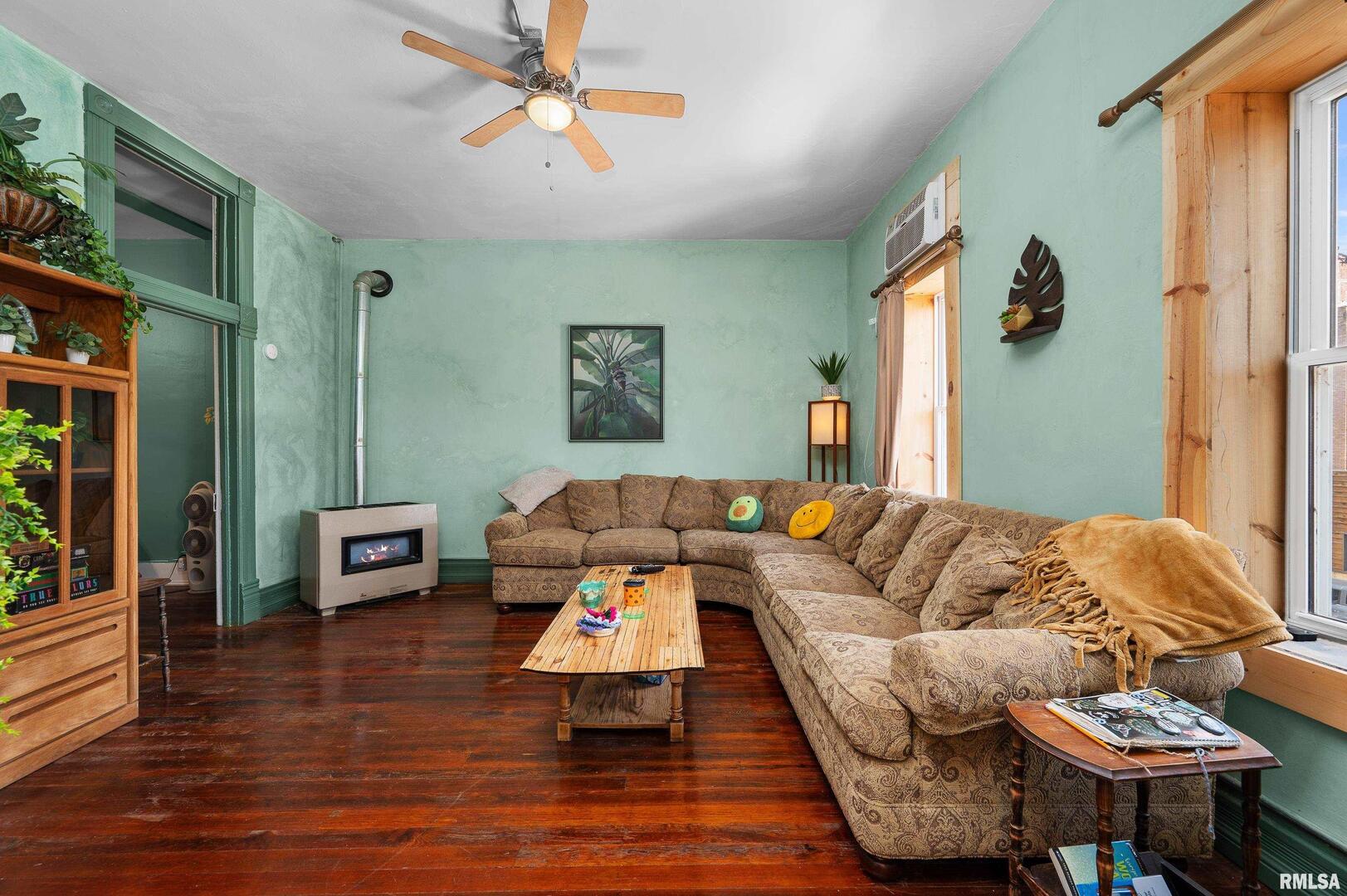 309 Main Street Savanna, IL 61074 - Photo 37 of 58 a living room with furniture and a wooden floor