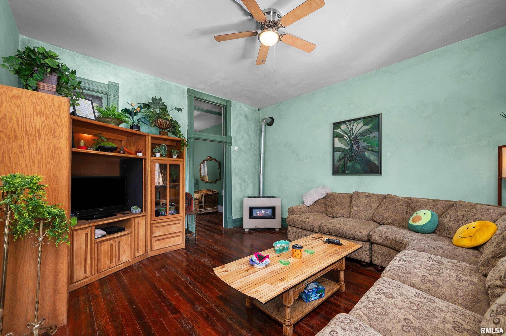 309 Main Street Savanna, IL 61074 - Photo 39 of 58 a living room with furniture and a flat screen tv