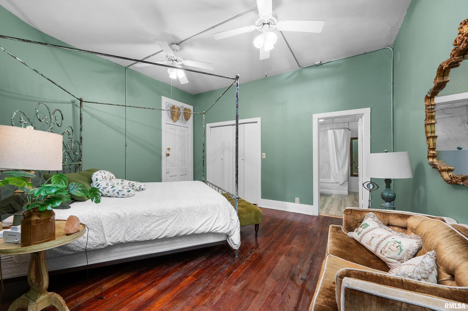 309 Main Street Savanna, IL 61074 - Photo 40 of 58 a bedroom with a bed and a chandelier