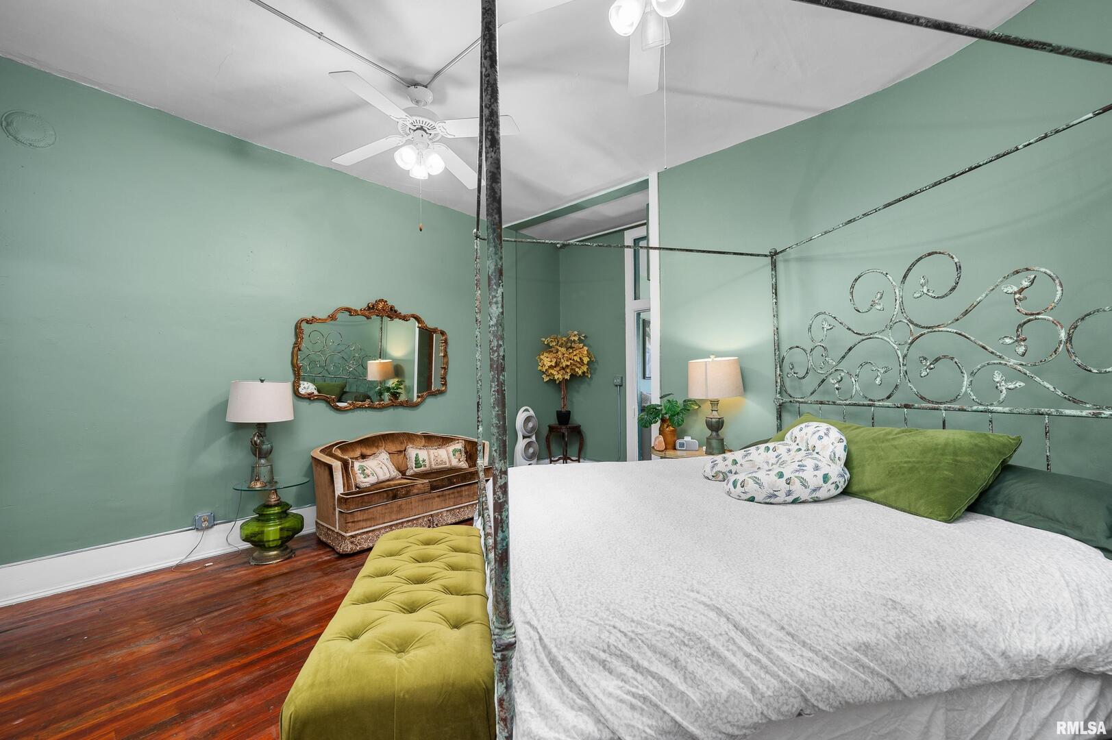 309 Main Street Savanna, IL 61074 - Photo 42 of 58 a bedroom with a bed and a chandelier