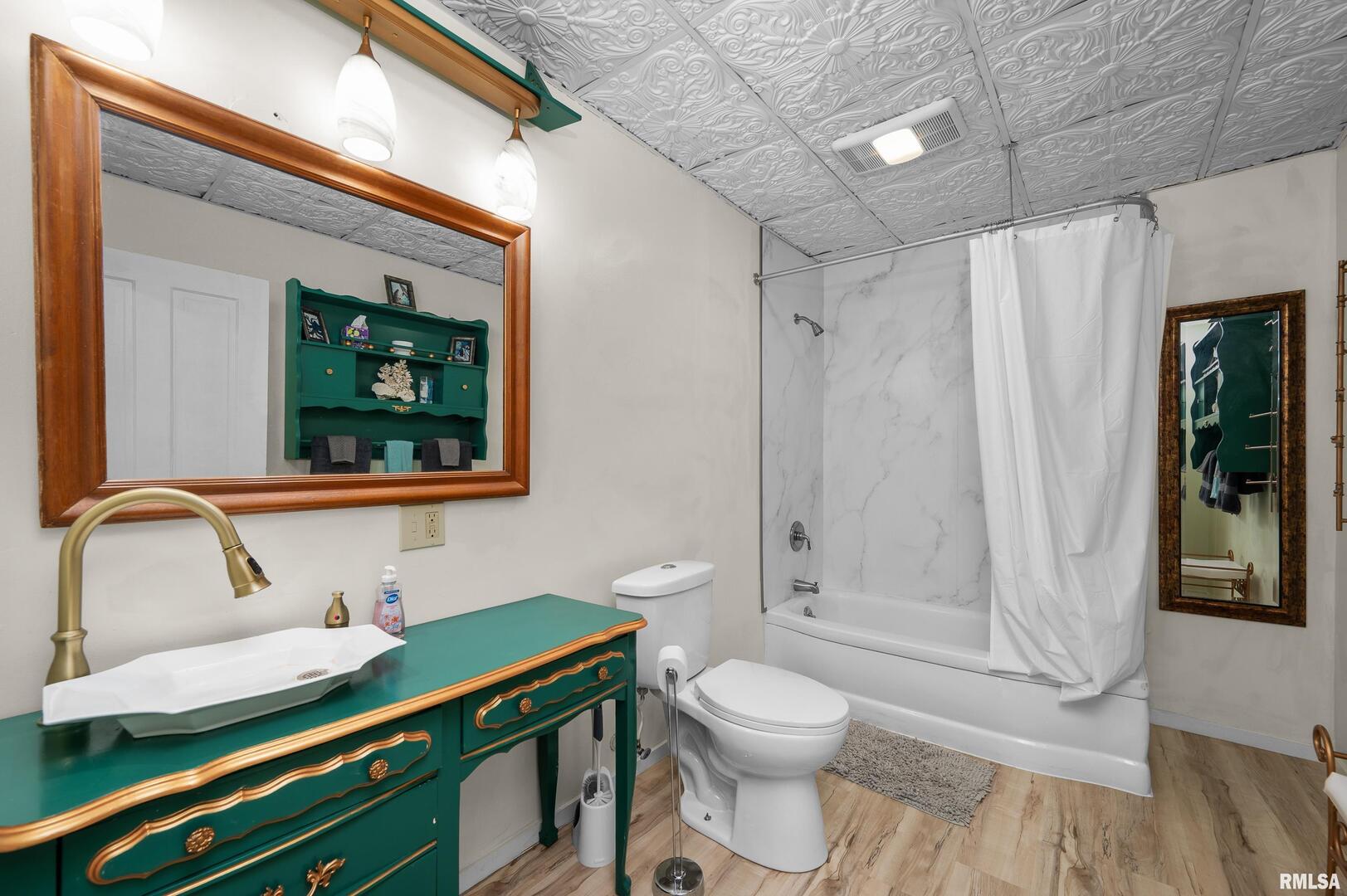 309 Main Street Savanna, IL 61074 - Photo 43 of 58 a bathroom with a sink a toilet and shower