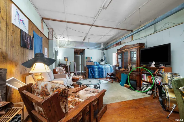 a very nice looking room with wooden floor