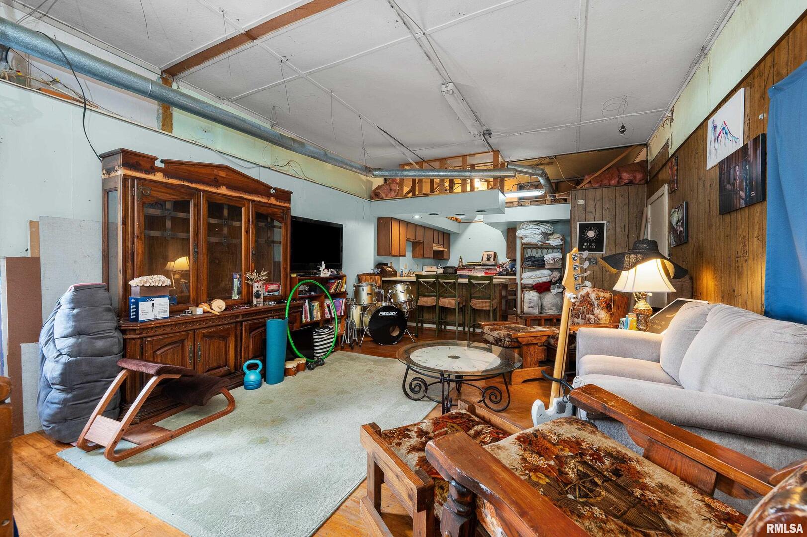 309 Main Street Savanna, IL 61074 - Photo 49 of 58 a living room with patio furniture and a large window