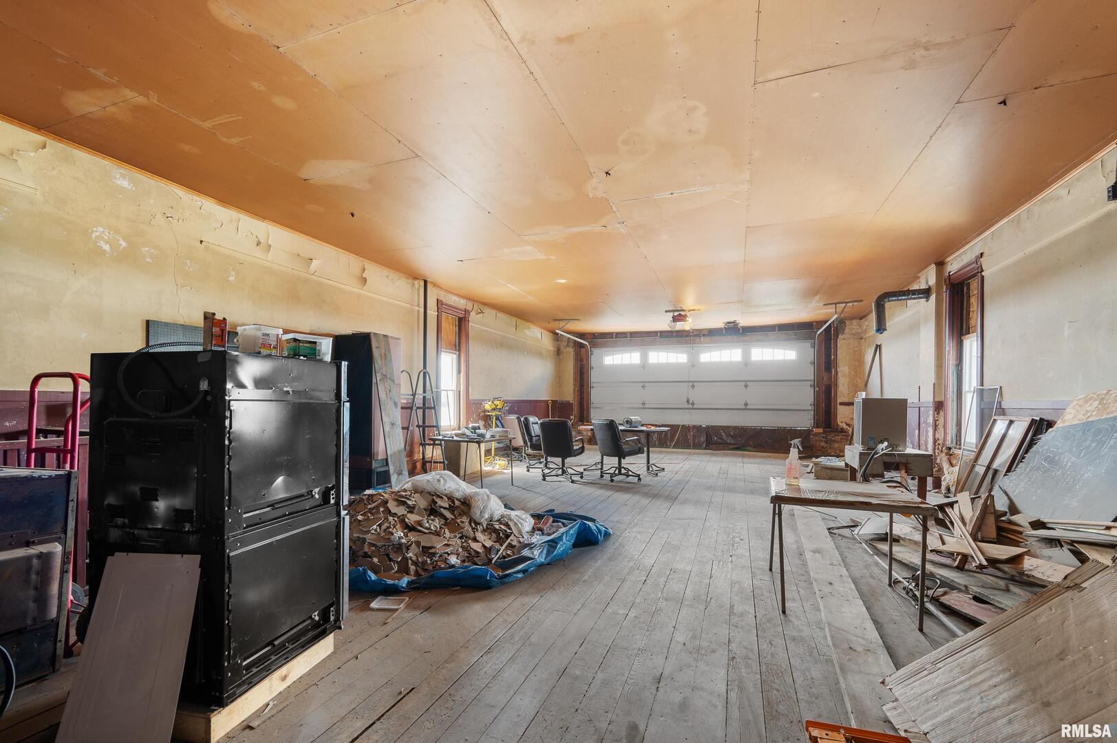 309 Main Street Savanna, IL 61074 - Photo 54 of 58 a gym room with lots of chairs and wooden floor