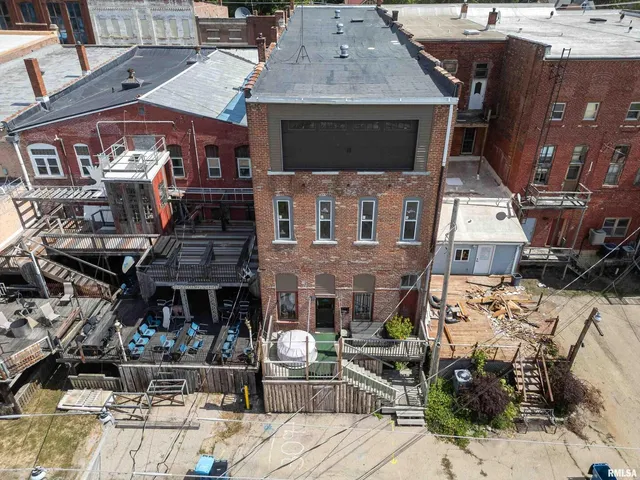 a outdoor living room with lots of furniture and a couch