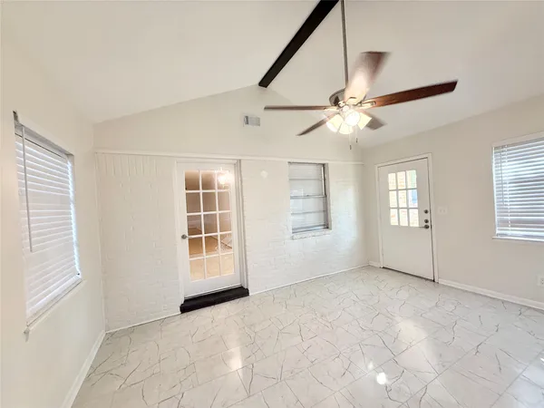 a view of an empty room with a window