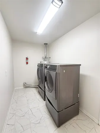 a utility room with washer and dryer