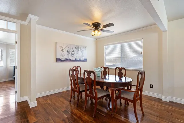 a view of a dining room with furniture window and wooden floor