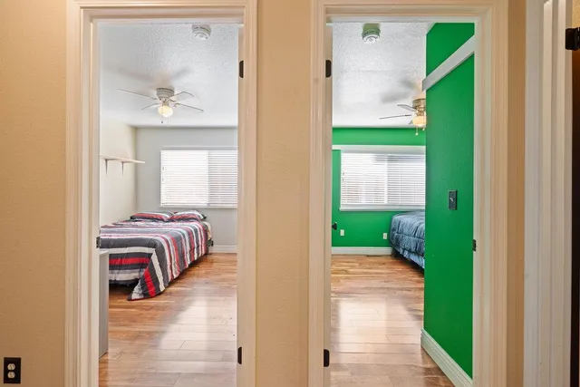 a view of a bedroom from a corridor