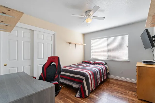 a bed room with a bed and a window