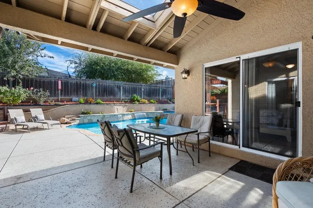 a outdoor space with swimming pool and furniture