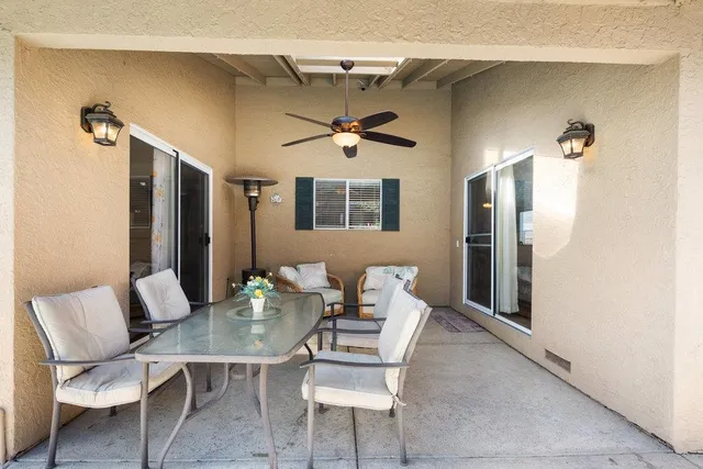 a workspace with furniture and a chandelier