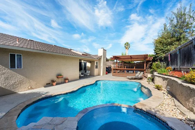 a view of a swimming pool with seating area