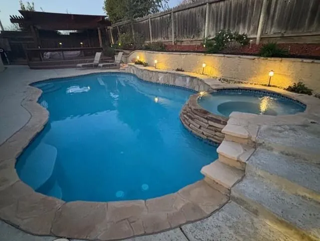 a view of swimming pool with chairs