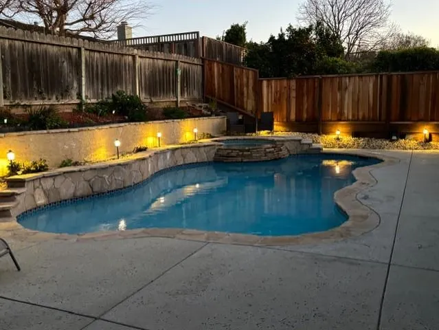 a view of a swimming pool with a seating space