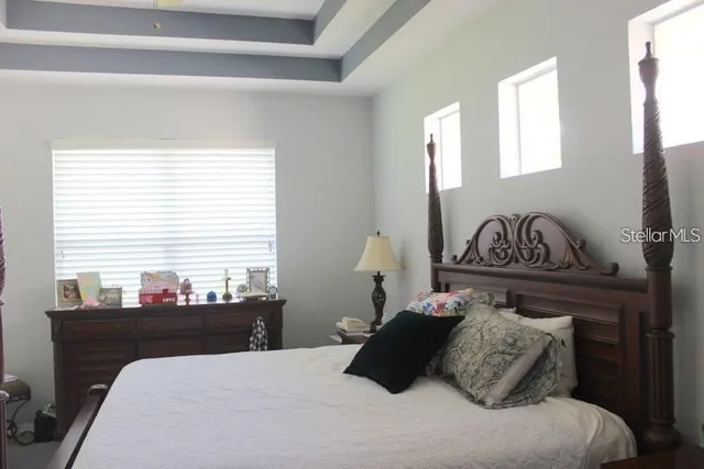 a bathroom with a tub and a window