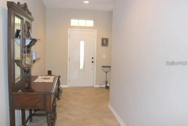 a view of a room with a table and chairs