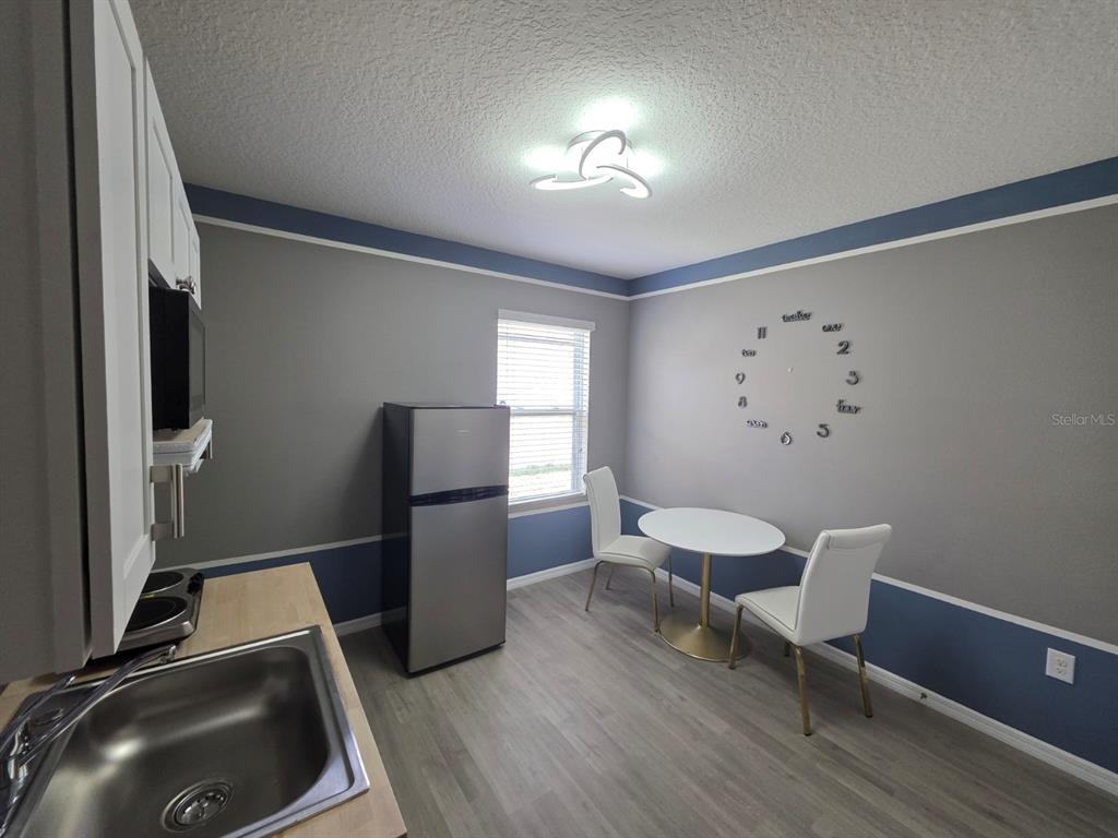 981 Chanler Drive Haines City, FL 33844 - Photo 6 of 11 a living room with furniture and a window