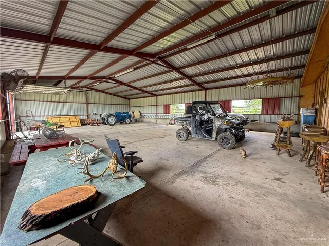 a view of parking garage with cars parked