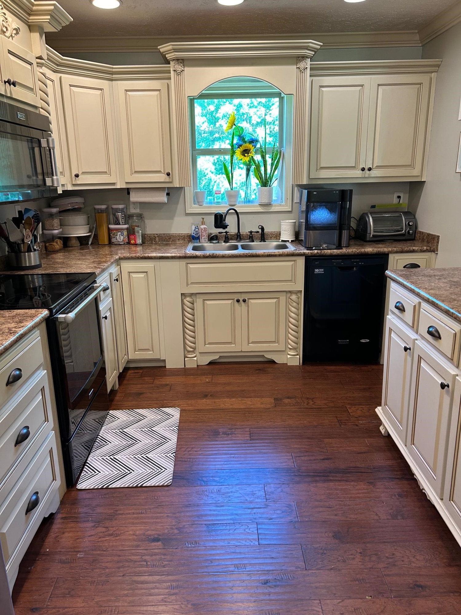 3250 Garland Road Pinson, TN 38366 - Photo 4 of 10 a kitchen with stainless steel appliances granite countertop a stove a sink and a microwave
