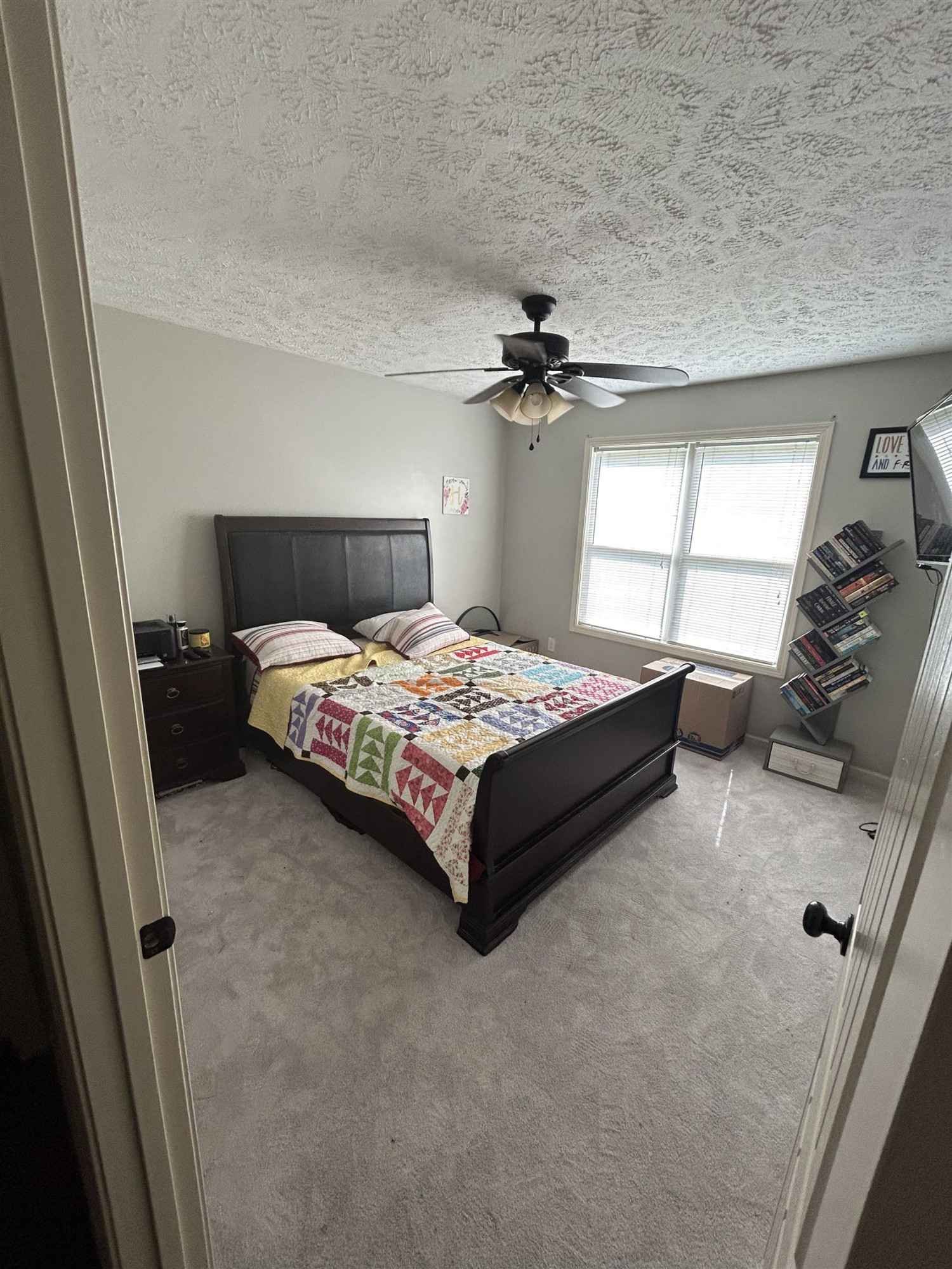 3250 Garland Road Pinson, TN 38366 - Photo 7 of 10 a bedroom with a bed and a dresser