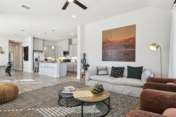 a kitchen with stainless steel appliances a stove a microwave and cabinets