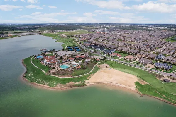 a view of a lake with houses in the background