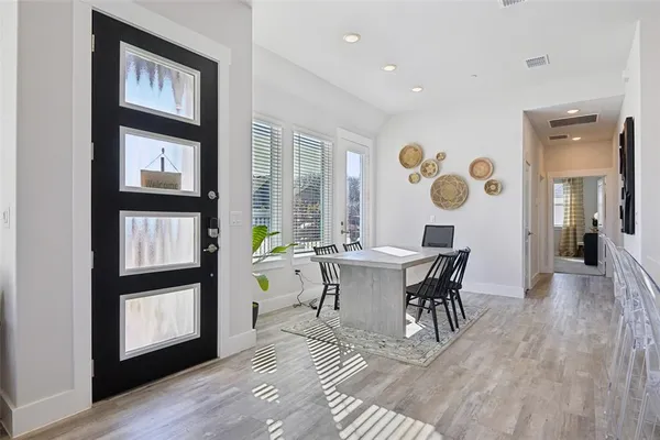 a view of a dining room with furniture and window