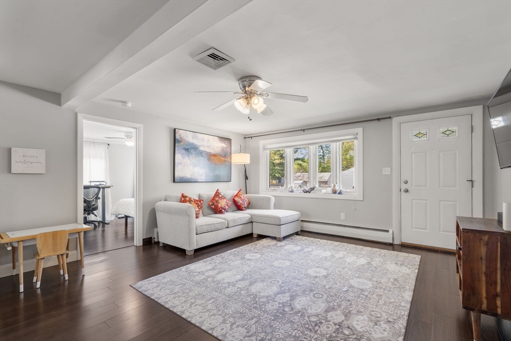 5 Eclipse Avenue Chelmsford, MA 01824 - Photo 3 of 25 a living room with furniture and a large window